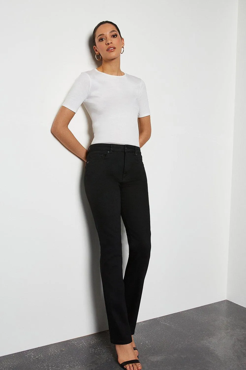 Power Stretch Black Long Kick Jeans | Karen Millen